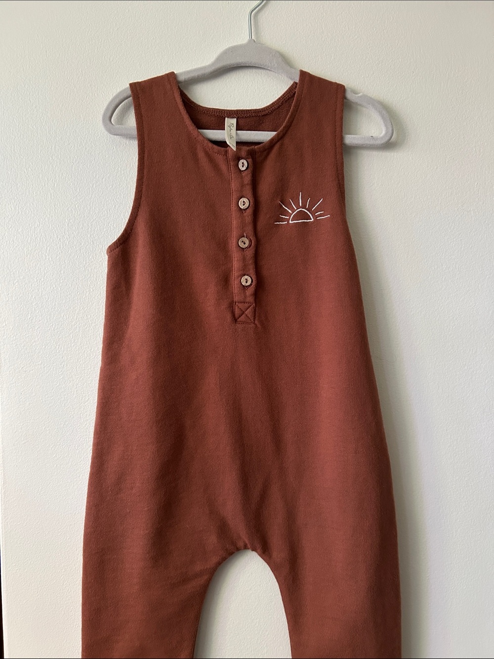 Rylee and Cru Sleeveless Button Front Romper in Rust with Sun Embroidery